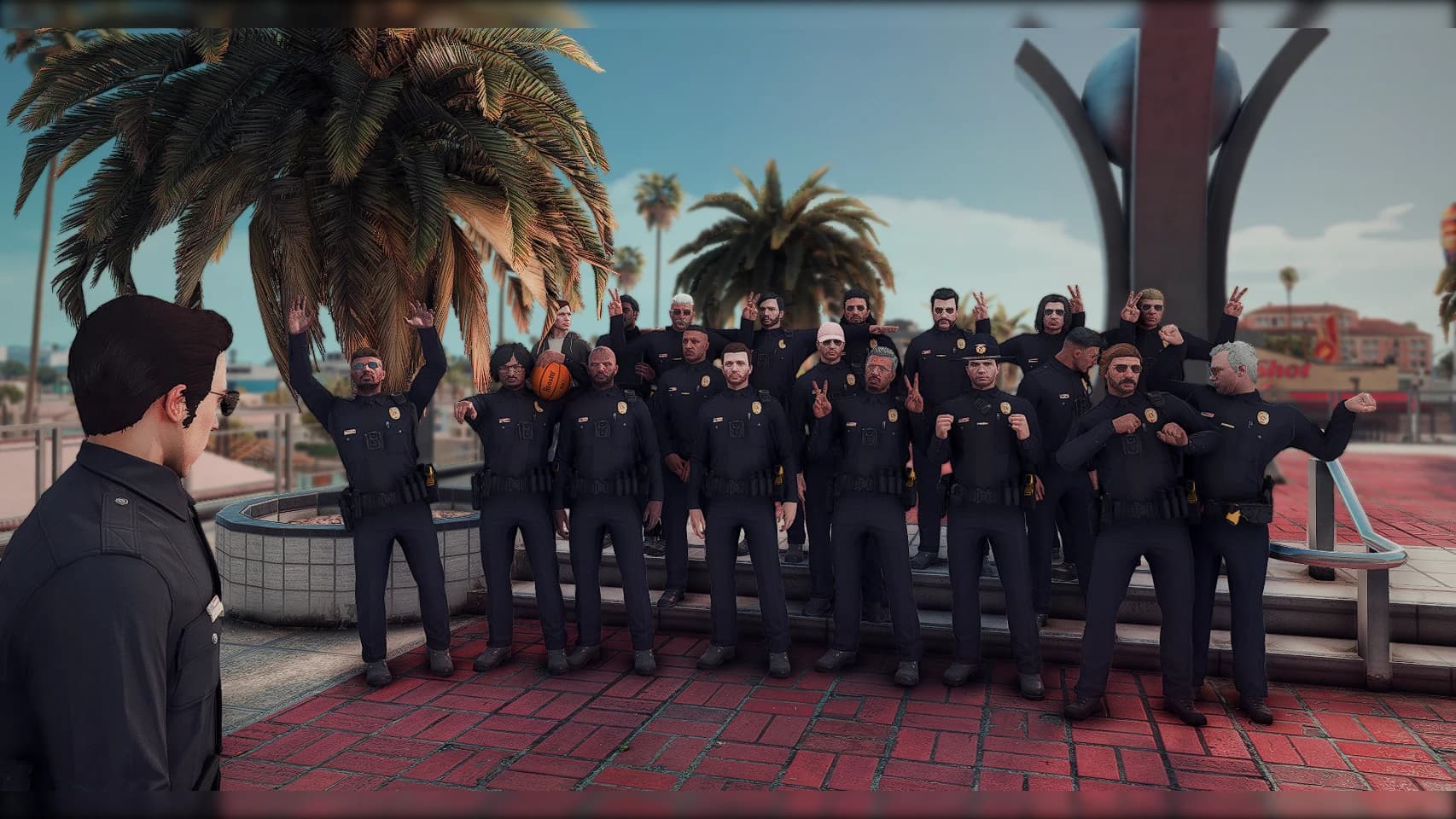 Circuit community members posing together in a palm-lined city plaza